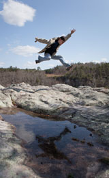 jumping through the air at Little River Canyon