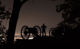 James with cannon at night